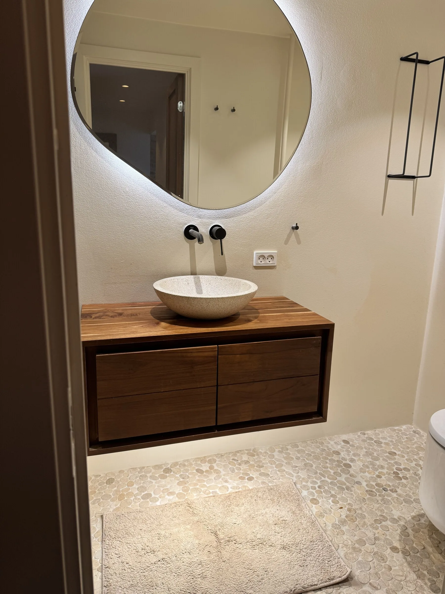 Restored wooden bathroom vanity in a Copenhagen home