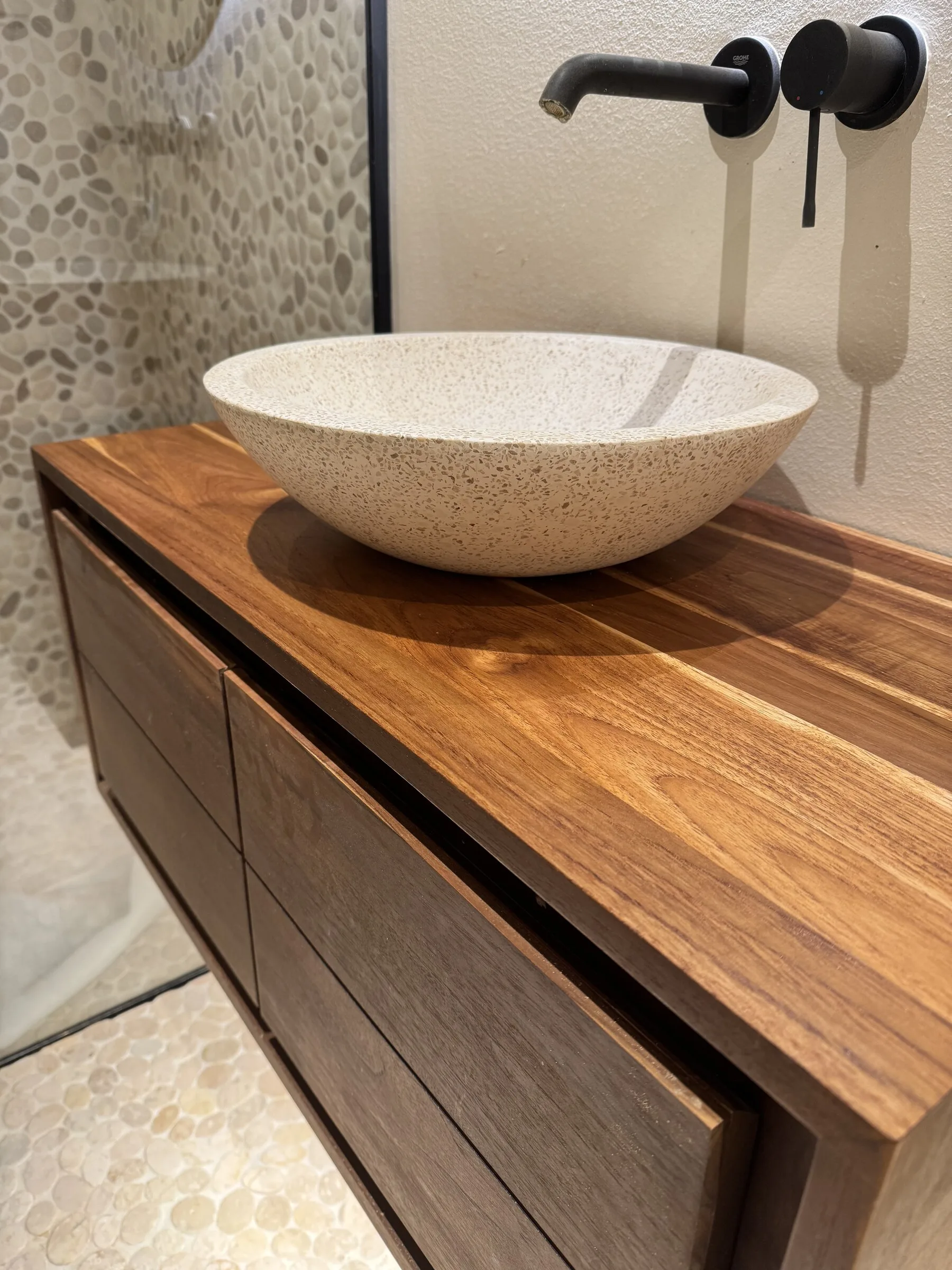 Restored bathroom vanity top after sanding and oiling, with a cleaner and warmer wood surface