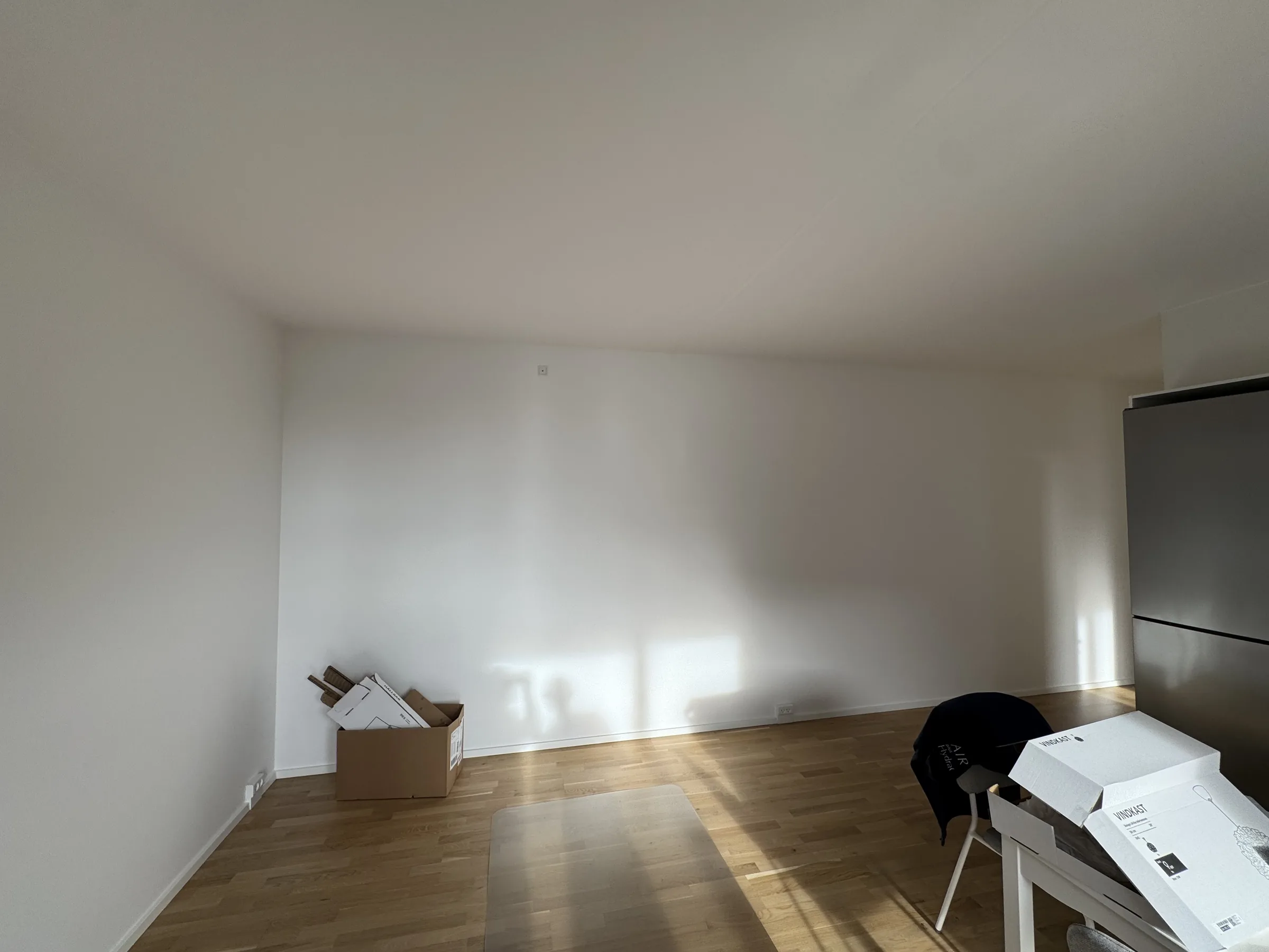 Typical room setup before ceiling lamp installation, with the existing ceiling point visible