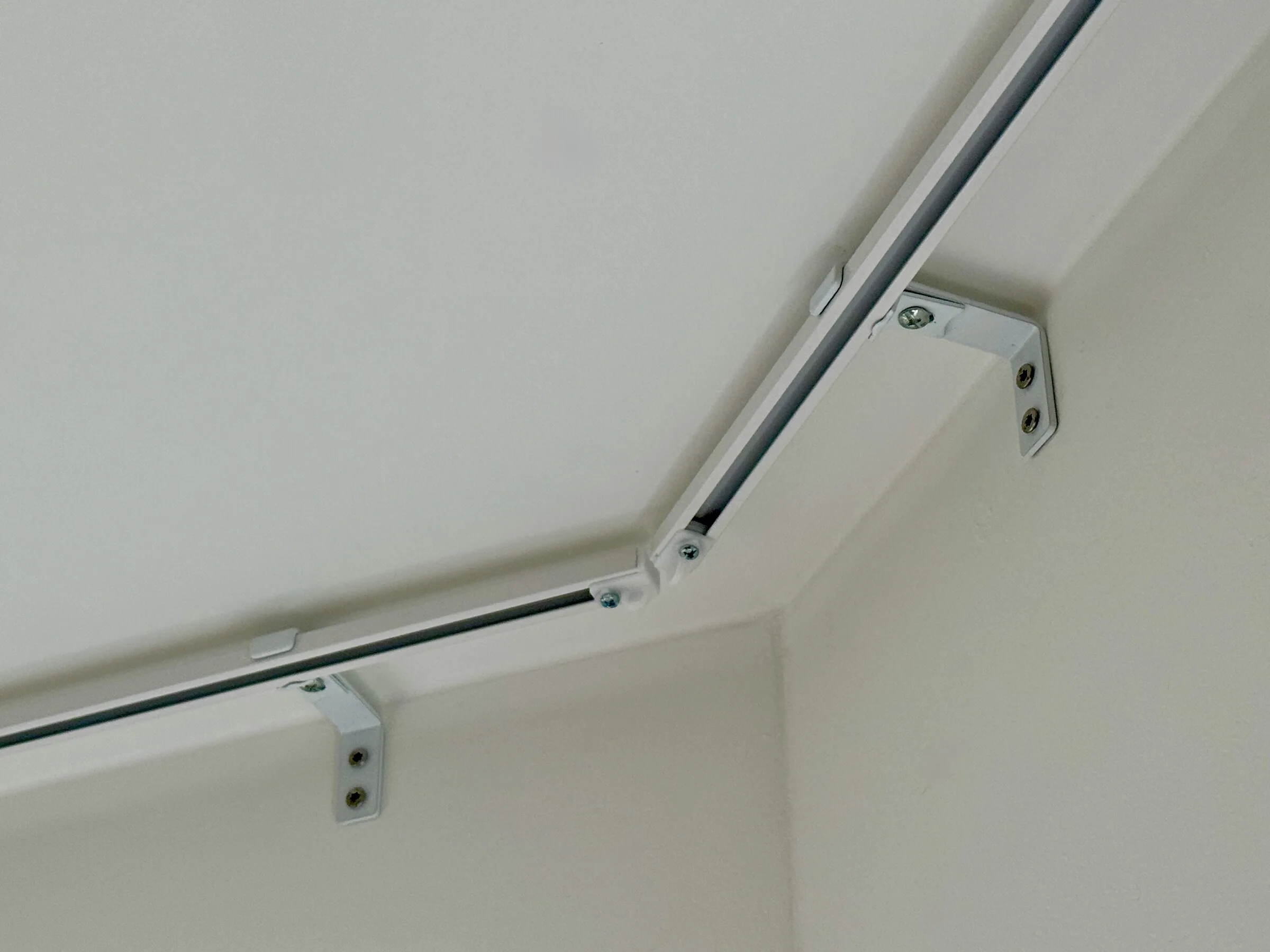 Corner curtain rail detail with bracket fixings from a recent Copenhagen apartment installation