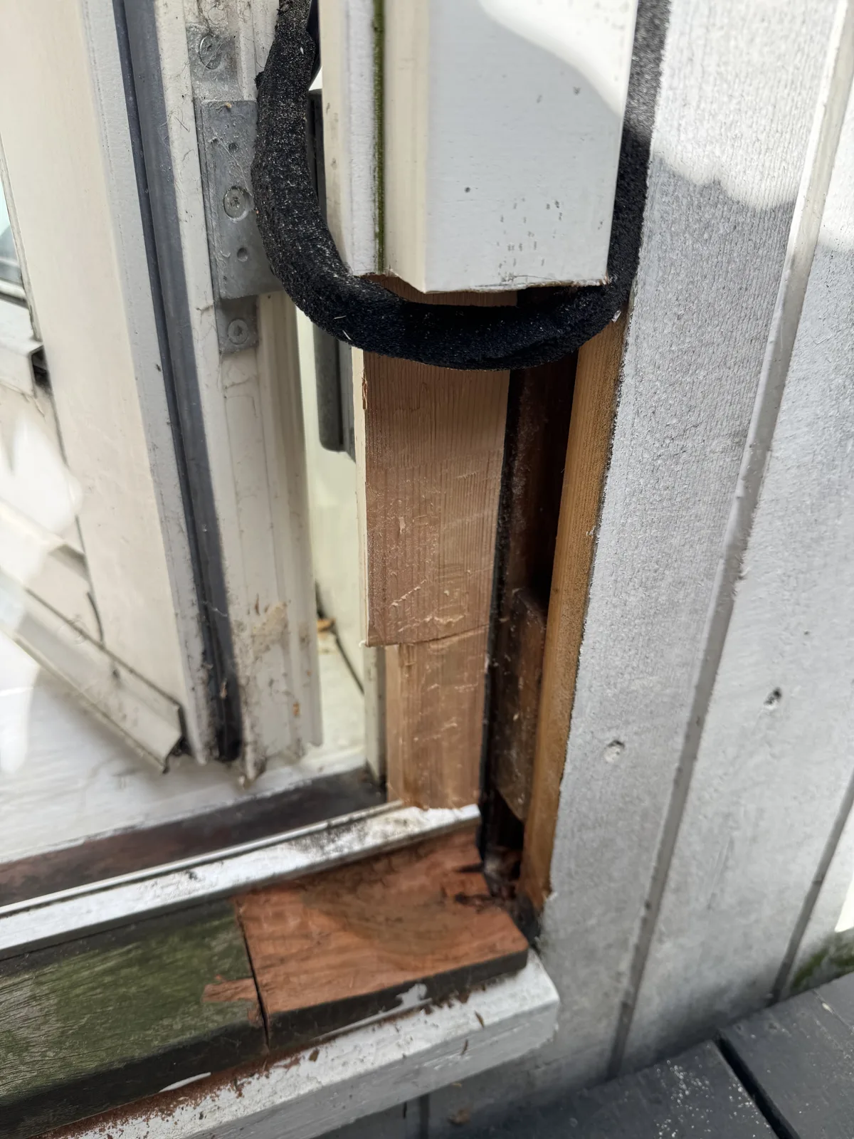 Custom-made wood insert aligned to rebuild the frame base