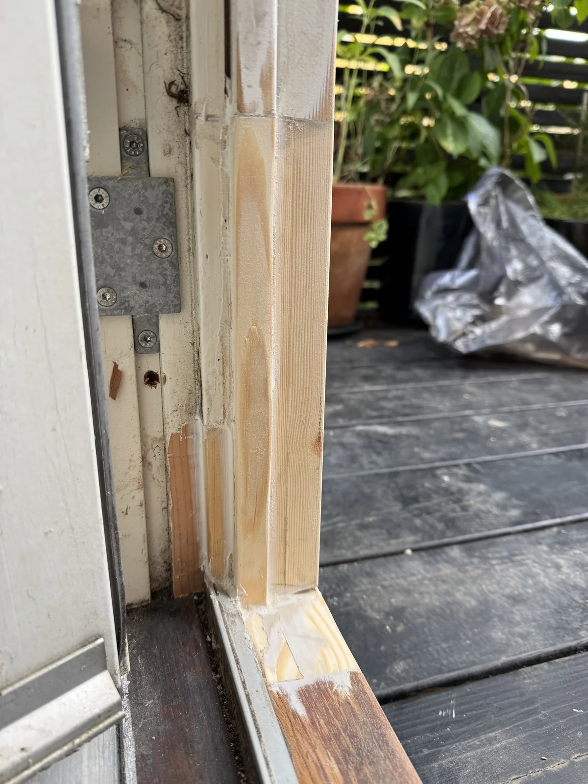 Door frame base restored and painted — detail of final finish