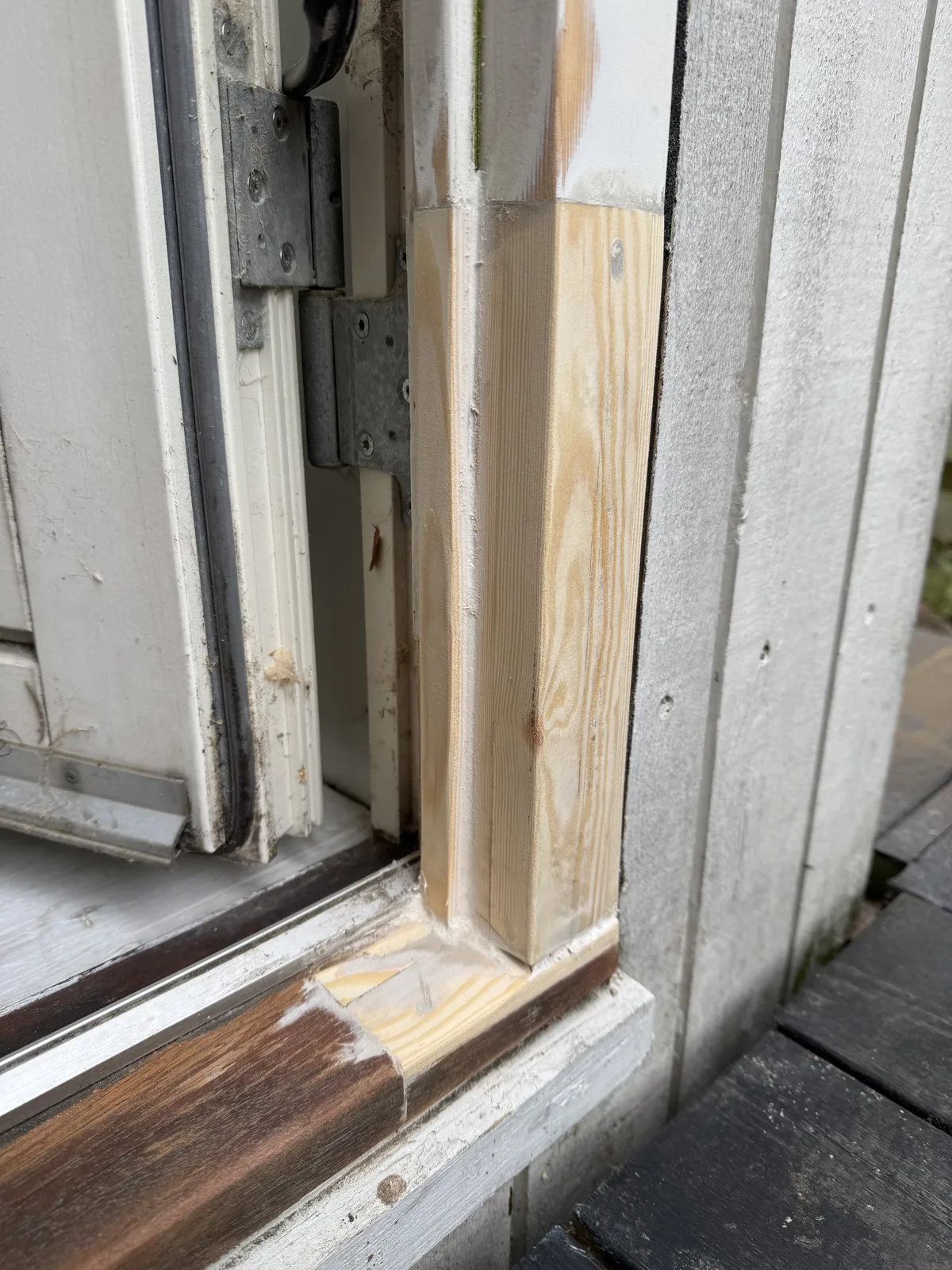 Final wide view of the restored door frame base