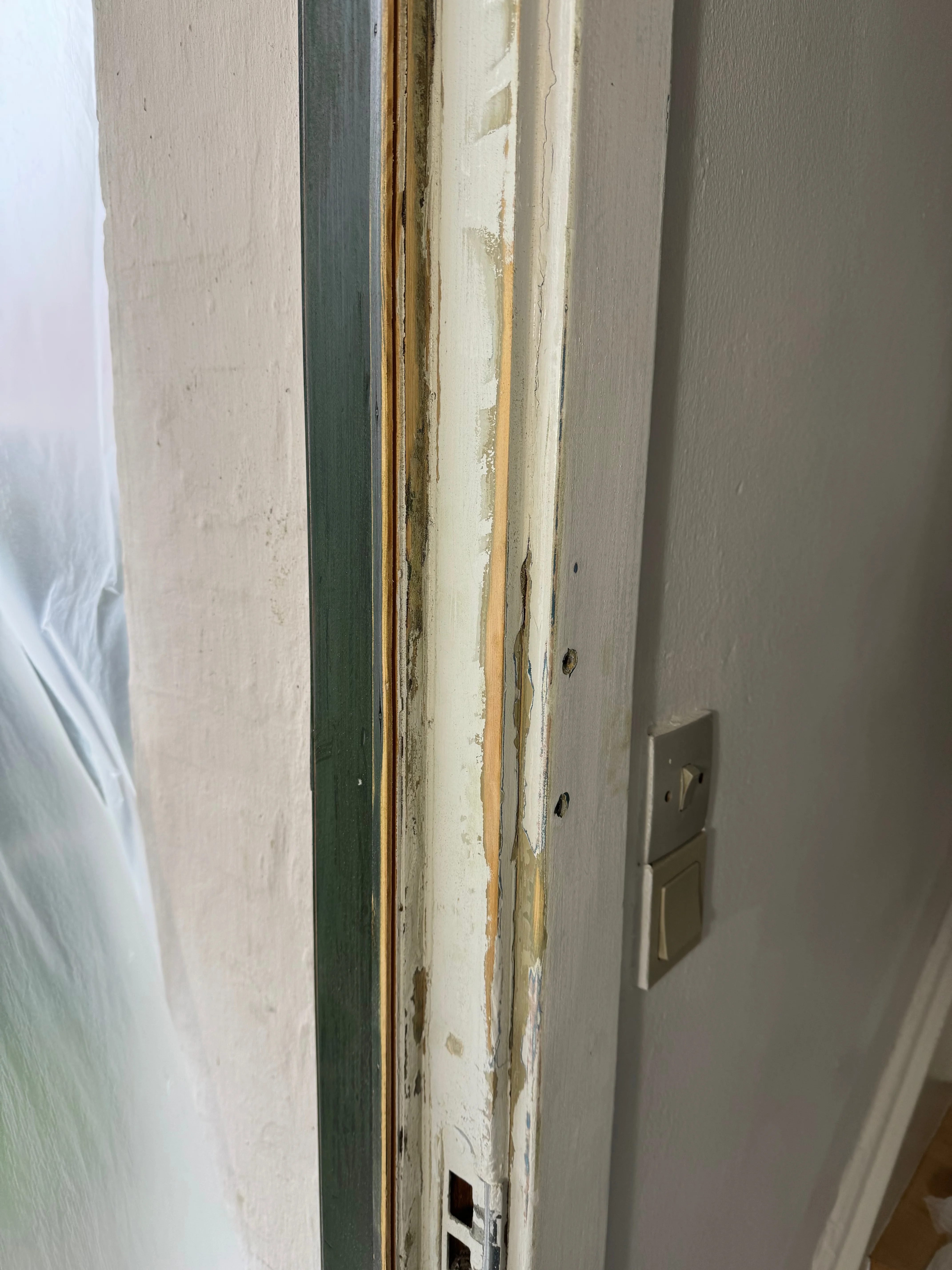 Door frame base restored and painted - detail of final finish