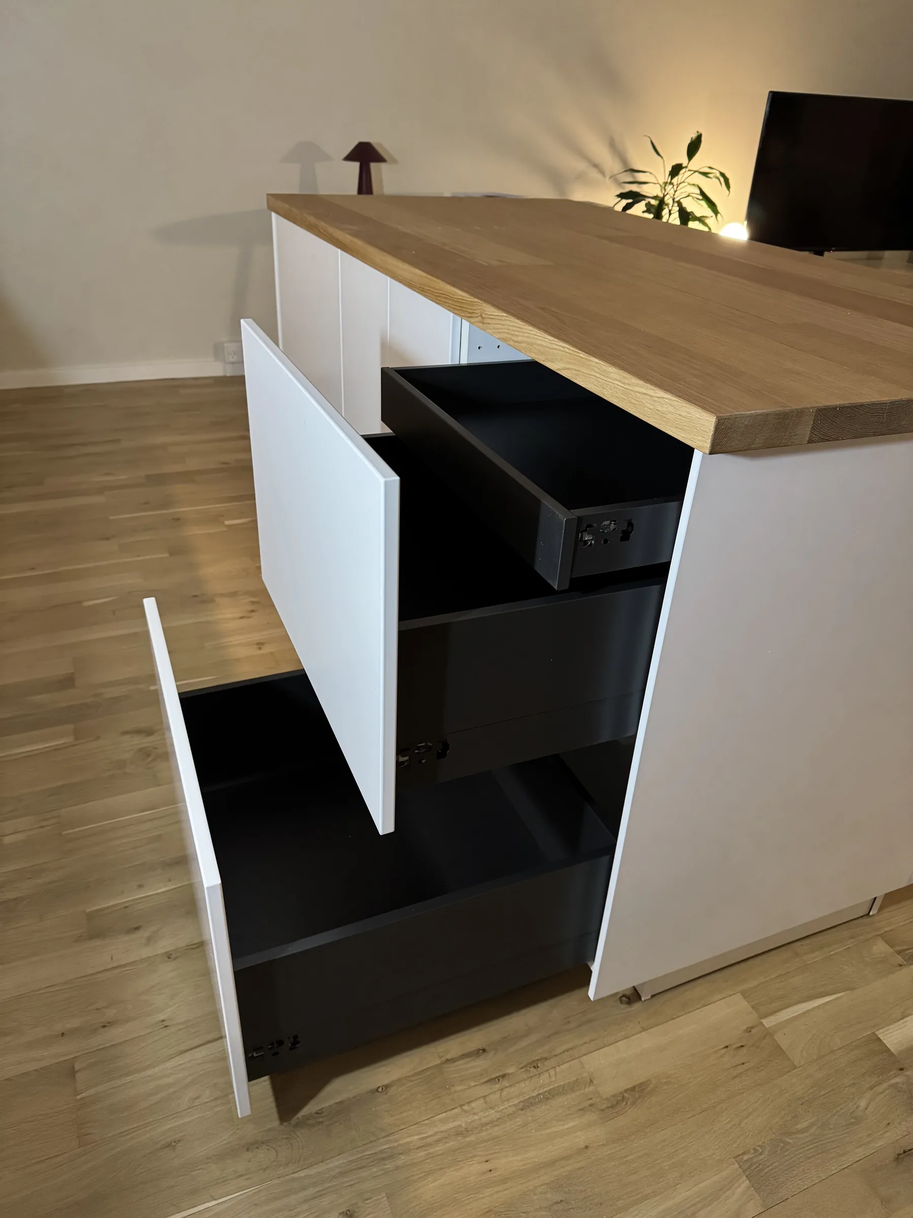 Drawer fronts and runners being aligned on an assembled IKEA unit during a recent fitting example