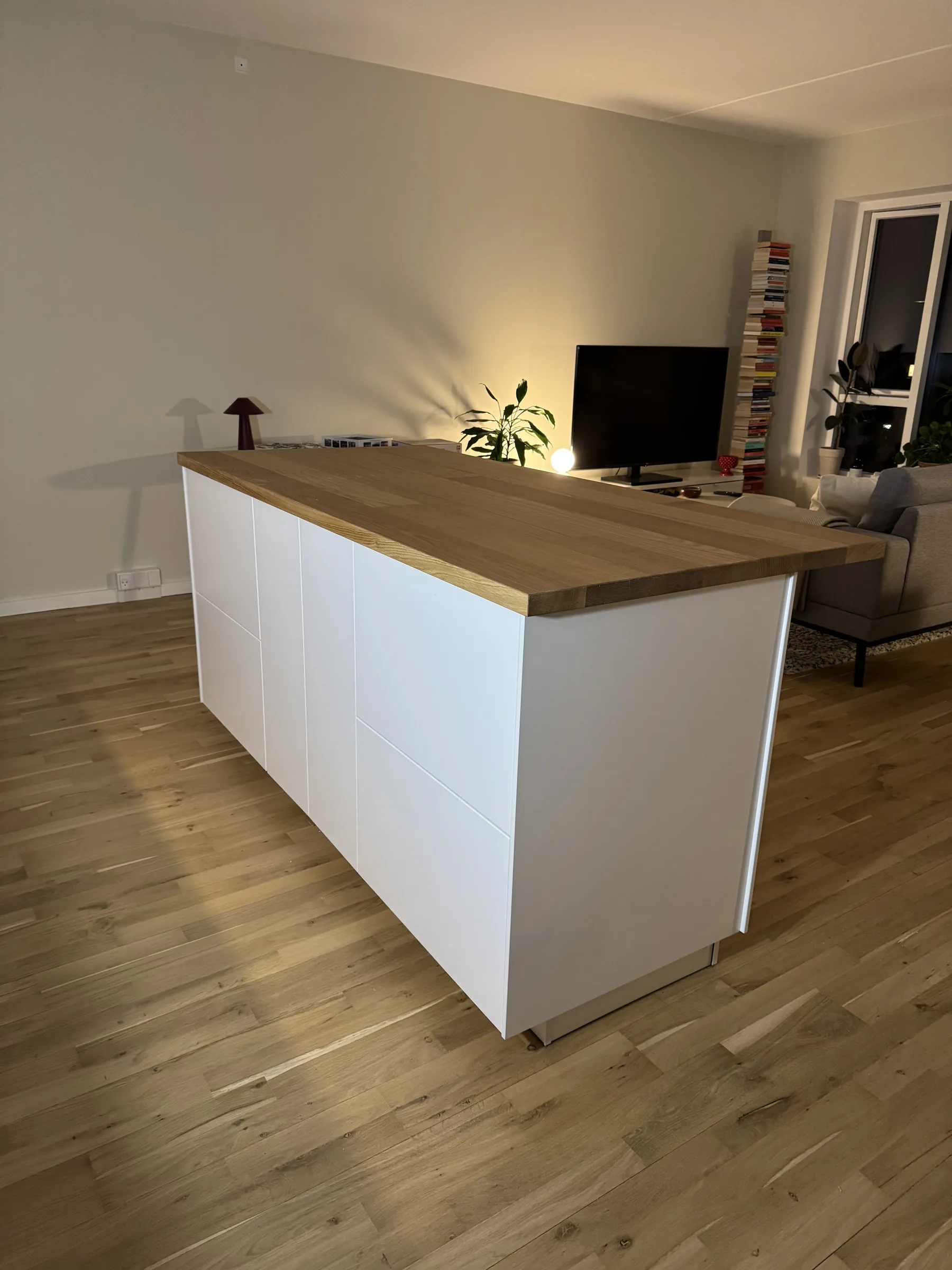 Finished IKEA storage unit with wood top placed as part of a recent apartment assembly example