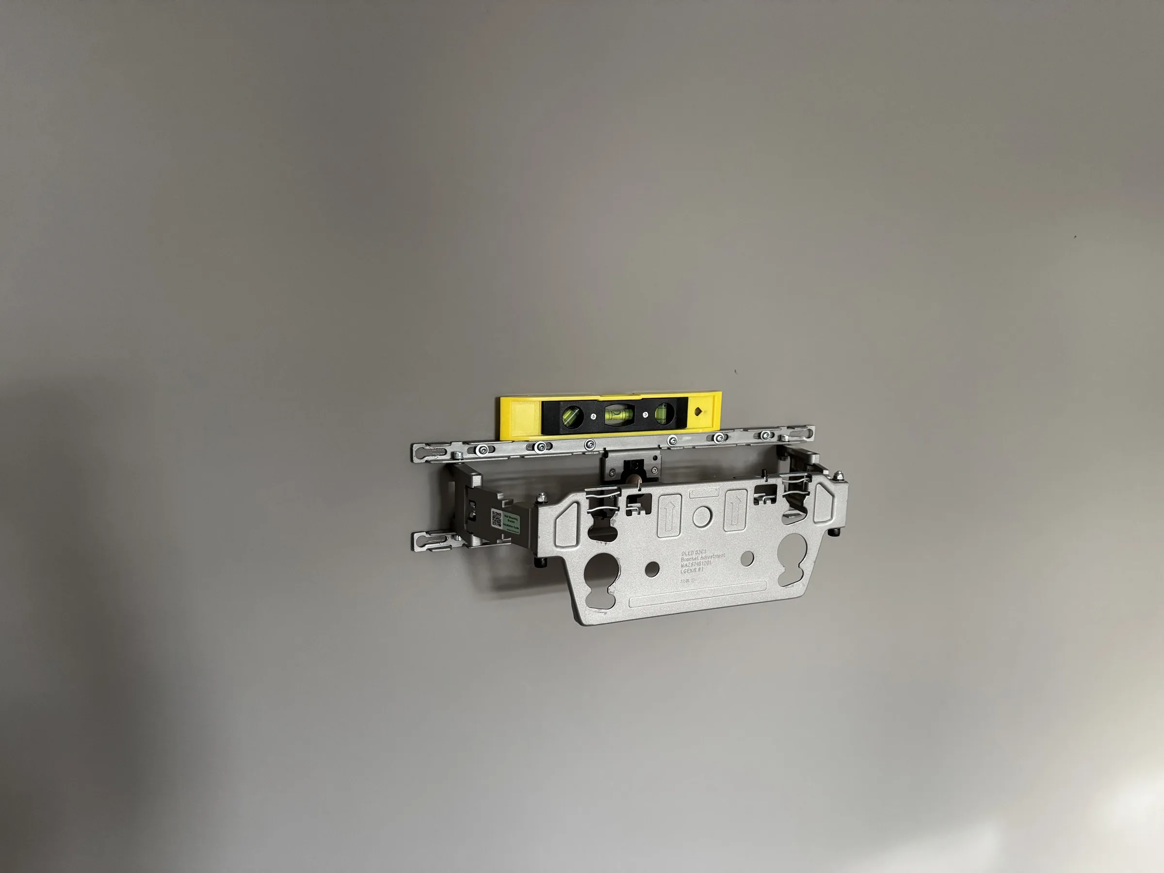 TV wall bracket positioned on the wall before final fixing in a Copenhagen apartment