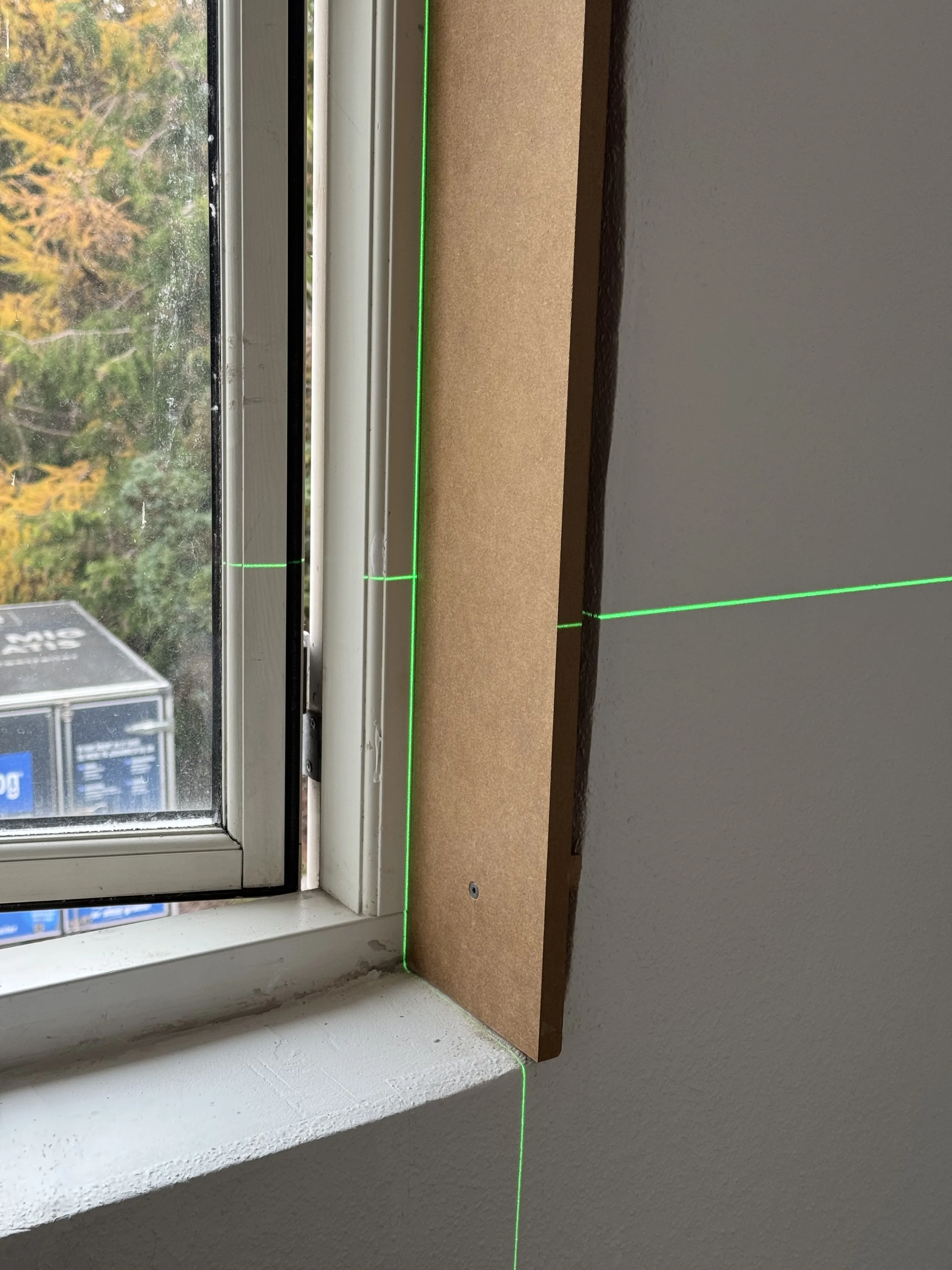 Close detail of measurement lines used to place the window trim edge