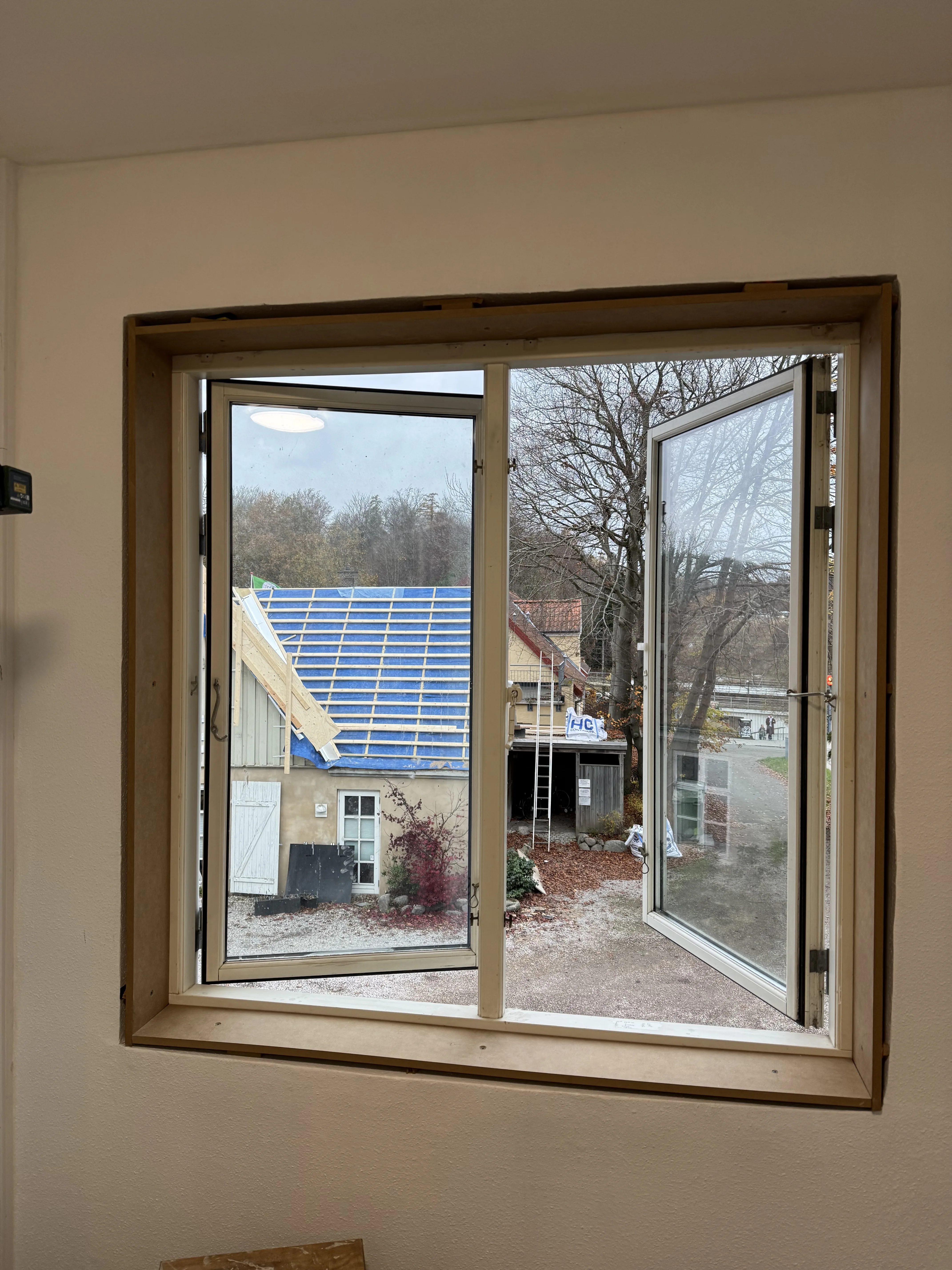 Completed window trim fitted neatly around the full window opening